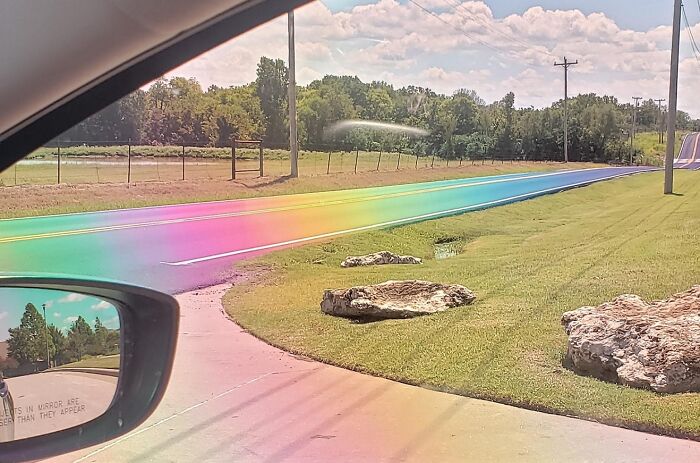 The Sun Hit This Freshly-Paved Tarmac Just Right And Made A Real-Life Rainbow Road Through Polarized Lenses