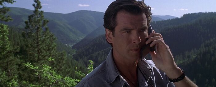 Harry talking on the phone in the mountains 