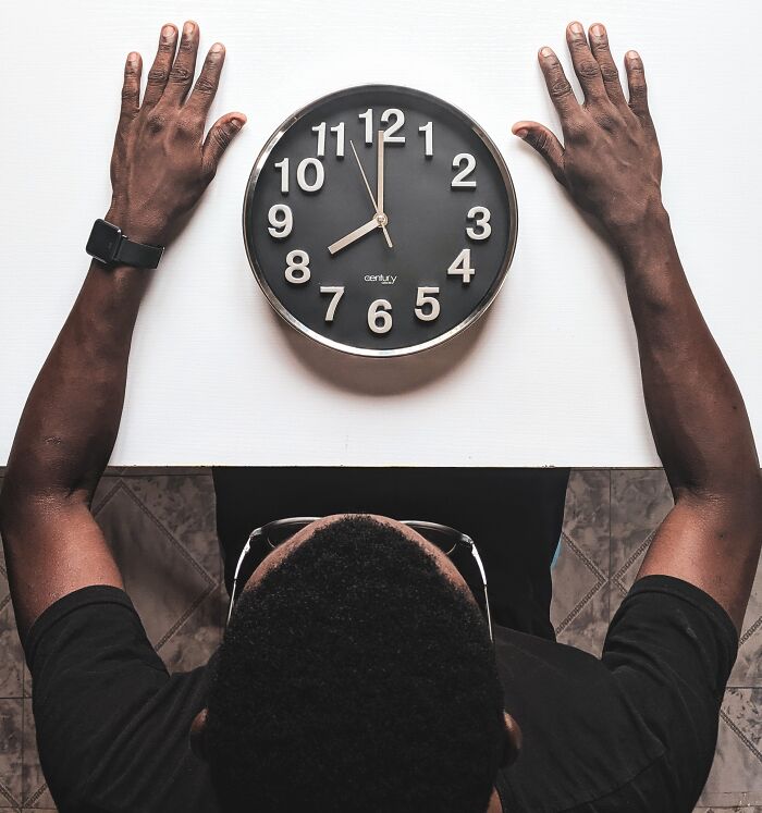 Man Sitting And Watching The Time 