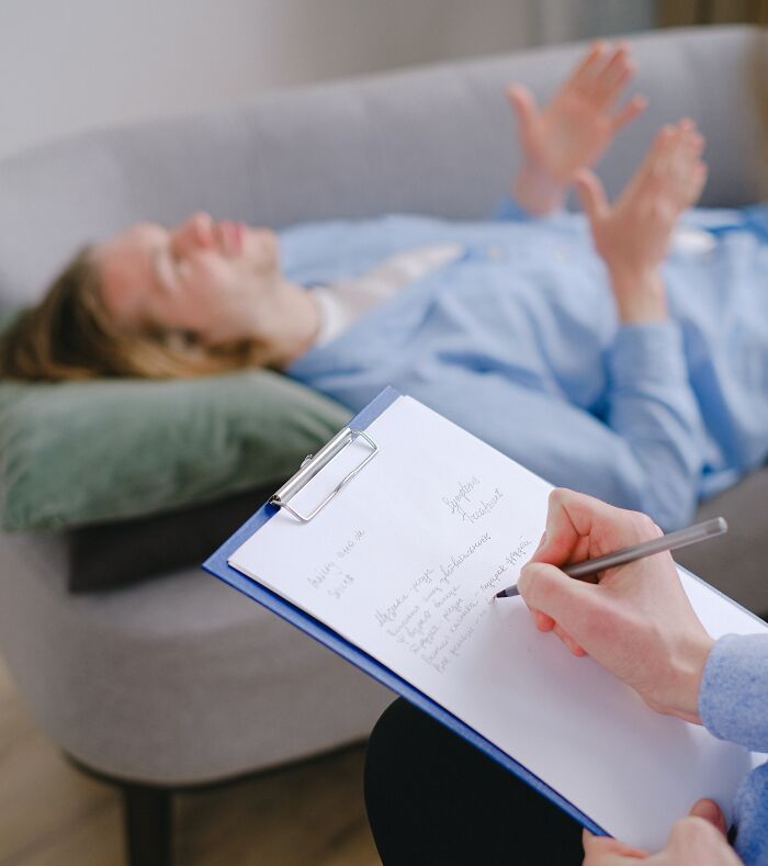 Person Speaking And The Other One Is Taking Notes 