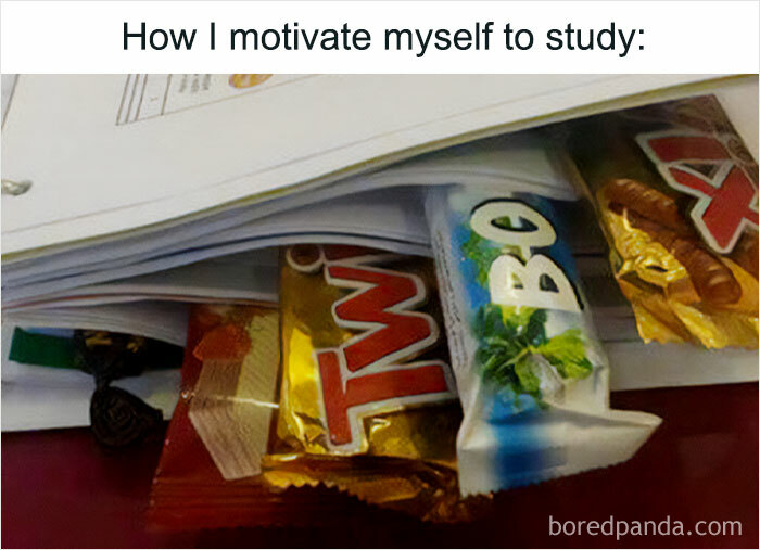 Stack of papers with candy bars underneath, humorously depicting student motivation techniques.