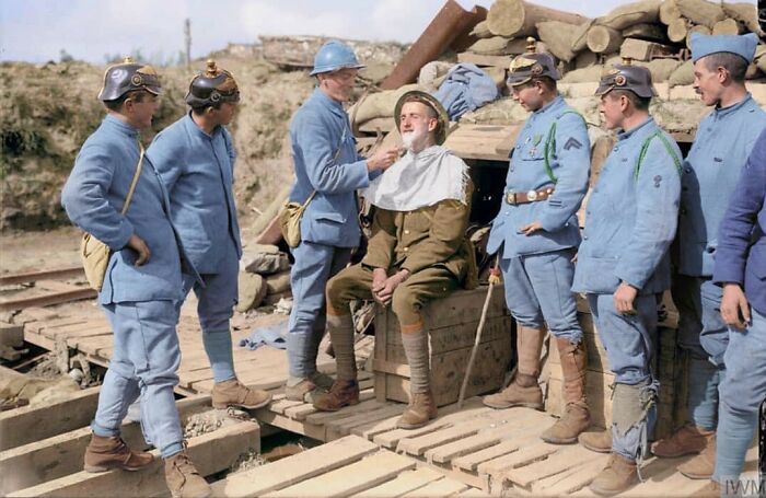 A French Soldier Giving A British Soldier A Shave In A Dugout In Boezinge, Belgium On 19 August 1917