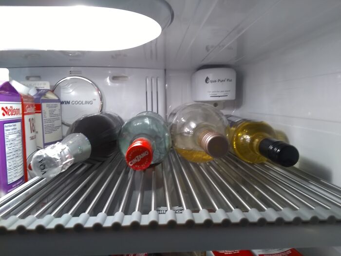 I Use An Amazon Dish Rack To Keep My Bottles Steady; You Don't See It Here But There Are A Few Butterfly Clips On The Left Side So They Don't Roll Over