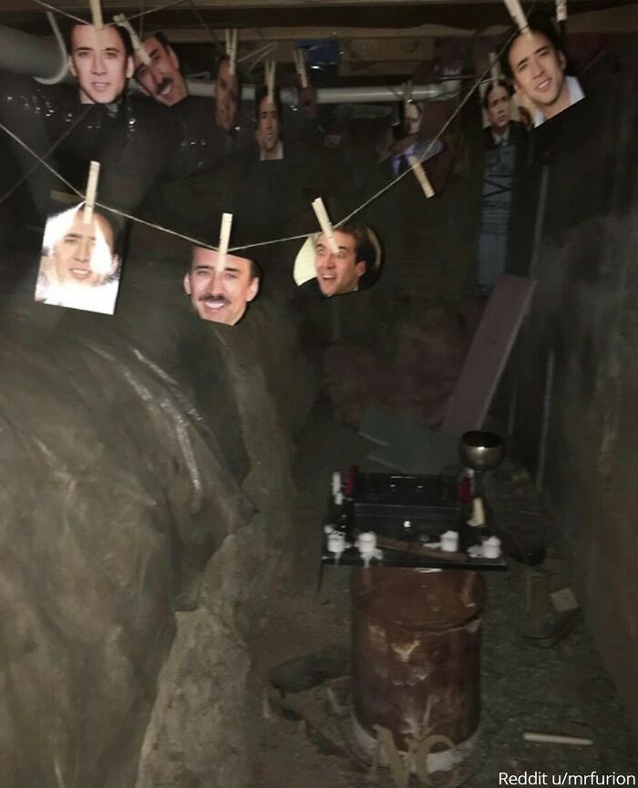 "A Friend Bought A New House And When A Cable Technician Went Into The Crawlspace They Found This Shrine To Nicholas Cage Complete With Candles, Goblet, Kneeling Rug And Lockbox Of Movie Paraphernalia."⁠