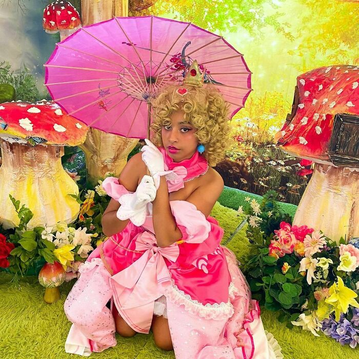 Person cosplaying Princess Peach from Super Mario Bros