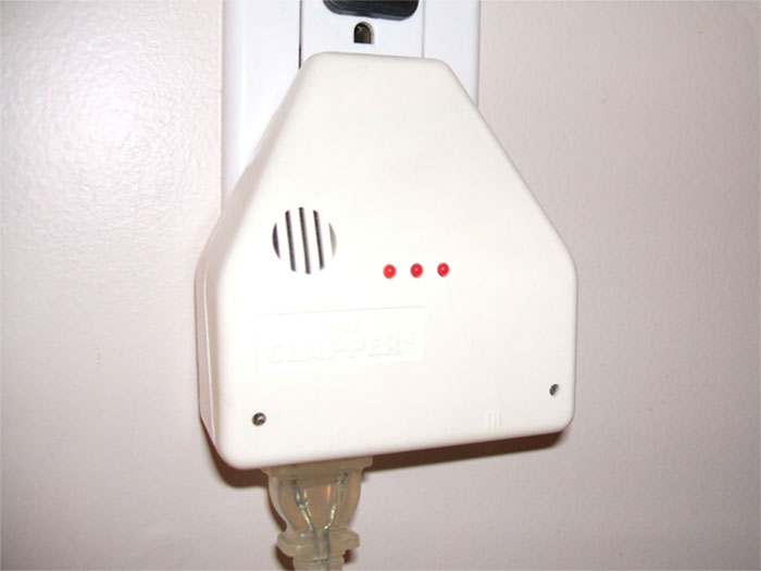 Vintage sound-activated gadget plugged into wall outlet, showcasing old gadgets that were trendsetters in their time.