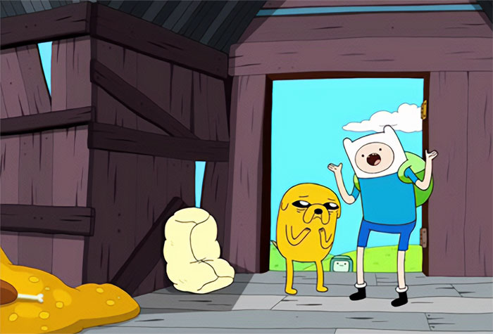 Finn the Human and Jake the Dog talking inside a wooden barn in an Adventure Time quotes scene.