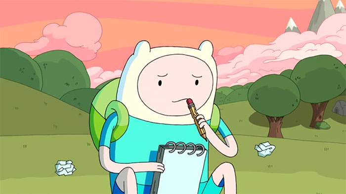 Finn the Human from Adventure Time holding a pencil and notebook, preparing to write wacky and profound quotes outdoors.