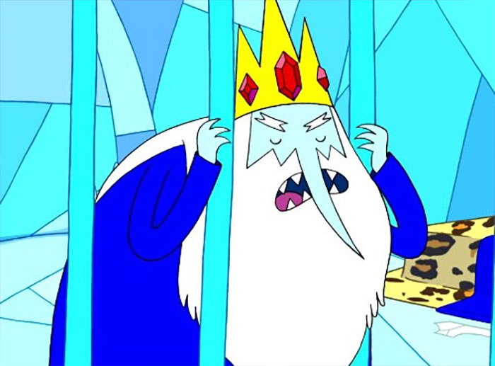 Hierophant character behind blue ice bars, expressing frustration in a colorful Adventure Time scene with wacky quotes vibe.