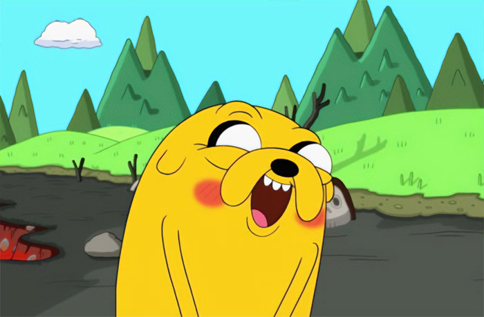 Jake the Dog blushing and looking shy in a colorful outdoor scene from Adventure Time quotes wacky moments.