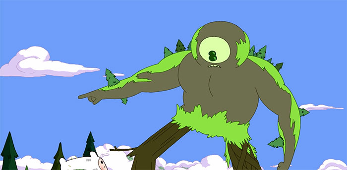 Forest Cyclops with a single eye covered in moss talking to Finn the Human in an animated Adventure Time scene.