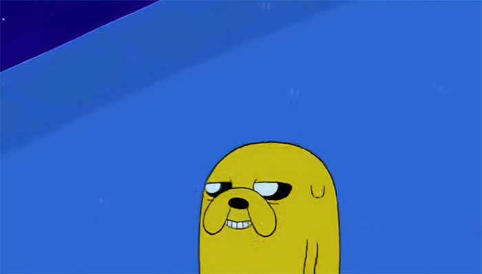 Jake the Dog smiling with a mischievous expression in Adventure Time featuring wacky and profound quotes