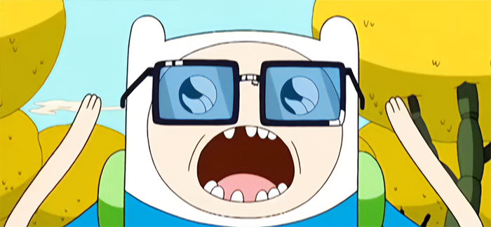 Finn the Human from Adventure Time wearing large glasses with a surprised expression in a colorful outdoor setting