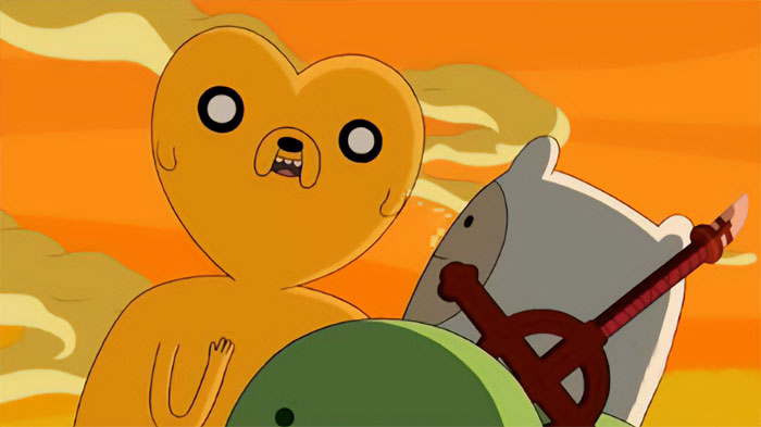 Jake the Dog head shaped like a heart with vivid orange sky background from Adventure Time quotes scene.