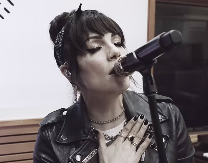 Woman singing into the microphone 