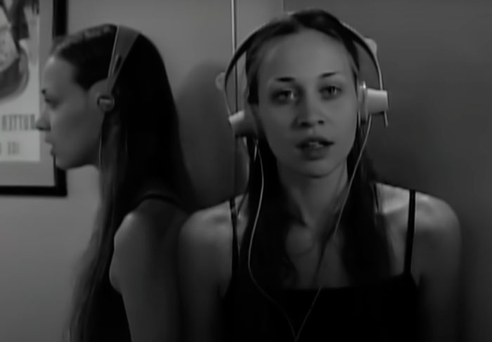 Woman with headphones singing 