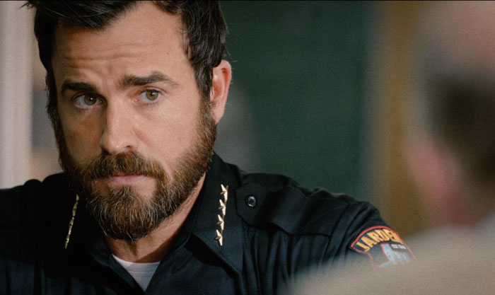 Police man looking suspiciously at someone 