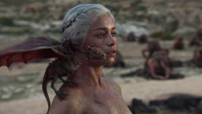 Woman with a small dragon on her shoulder