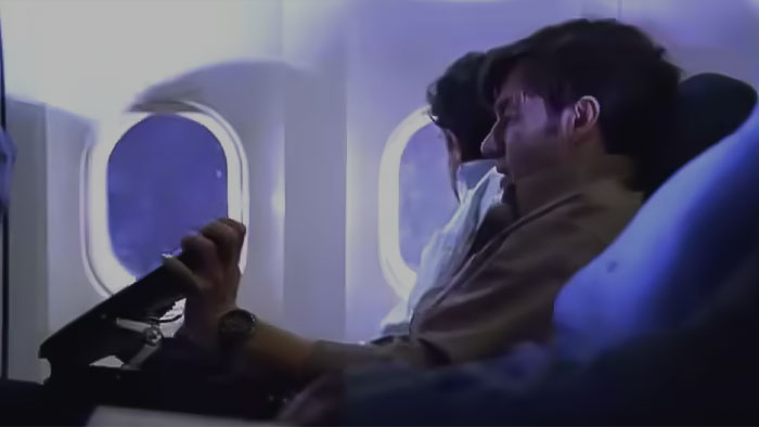 People sitting in the plain in Fringe pilot