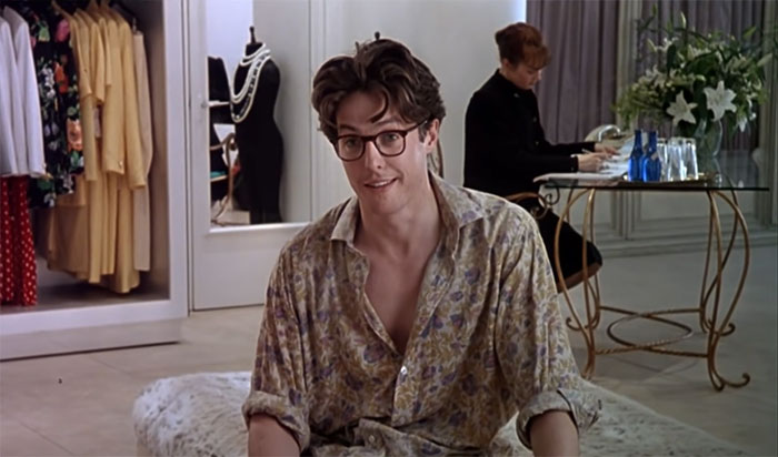 Scene from About Time movie featuring a young man in glasses, celebrating love in one of the best wedding movies ever made