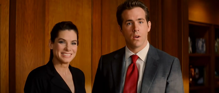 Actors Sandra Bullock and Ryan Reynolds in a scene from The Proposal, a top wedding movie celebrating love.