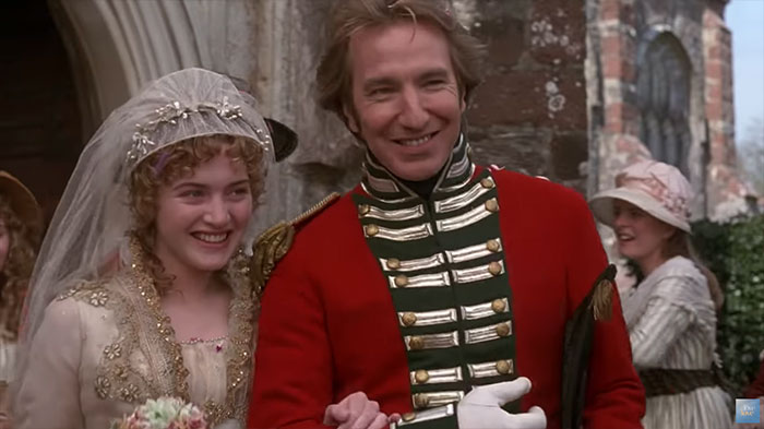 Scene from Sense And Sensibility wedding movie featuring a bride and groom celebrating love outdoors.