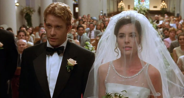 Scene from The Sweetest Thing movie showing a bride and groom at a wedding, part of best wedding movies celebration.