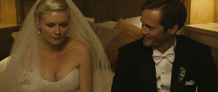 Bride and groom in a wedding scene from Melancholia, featured among the best wedding movies celebrating love.