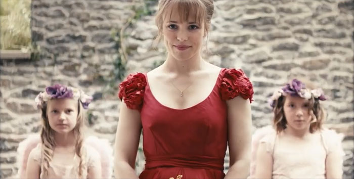 Scene from About Time movie featuring a woman in a red dress, celebrating love in one of the best wedding movies ever made