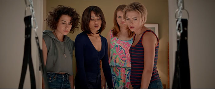 Scene from Rough Night featuring four women looking surprised, a memorable moment in wedding movies celebration.