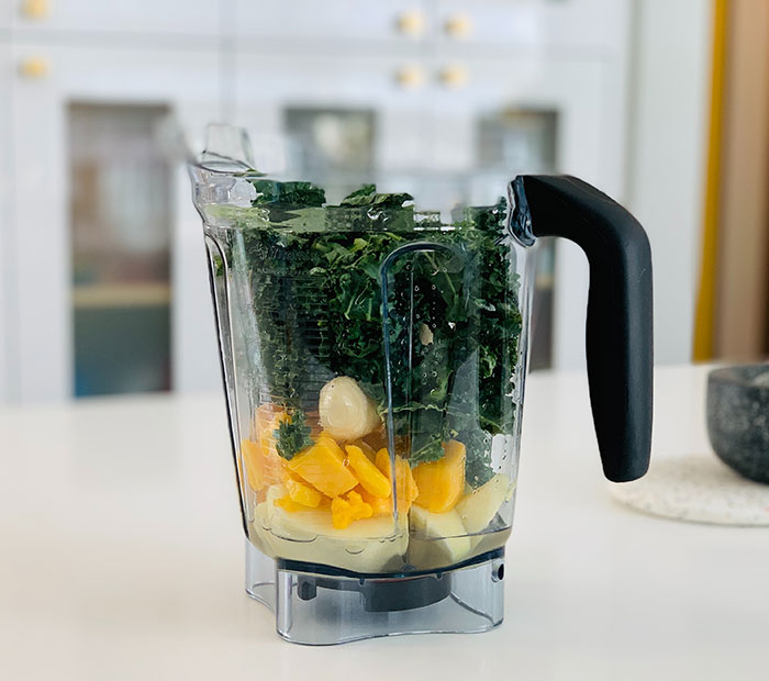 Clear glass pitcher with sliced fruits