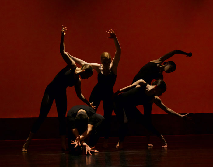 Multiple woman doing improv acting on a theaters scene 