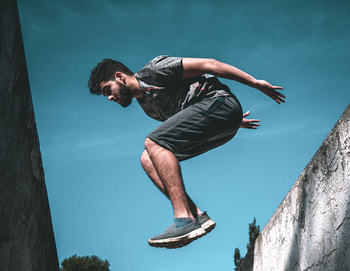 Man jumping from one building to the other 