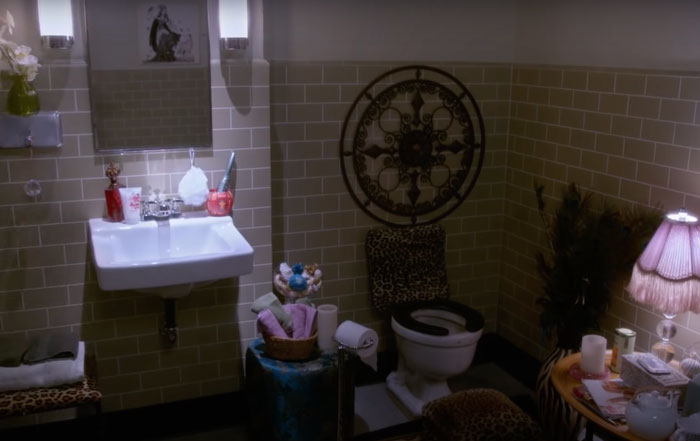 a white sink near the toilet in the bathroom