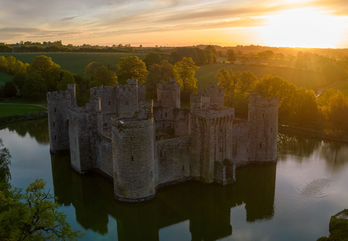 a stone castle surrounded by water
