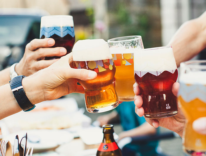 Friends holding beer