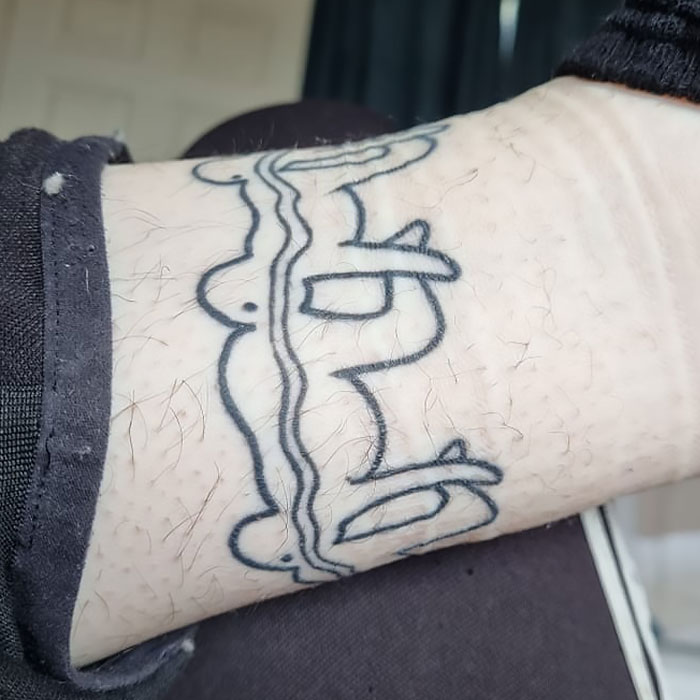 Close-up of a poorly executed tattoo on a wrist showing anatomical lines that illustrate tattoo fails so epic to share