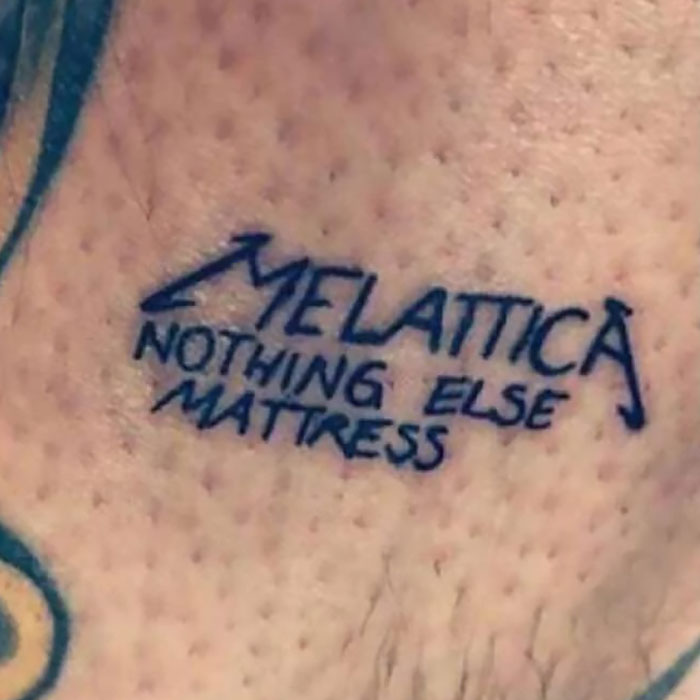 Tattoo fail showing a misspelled Metallica band logo with the words nothing else matress on skin.