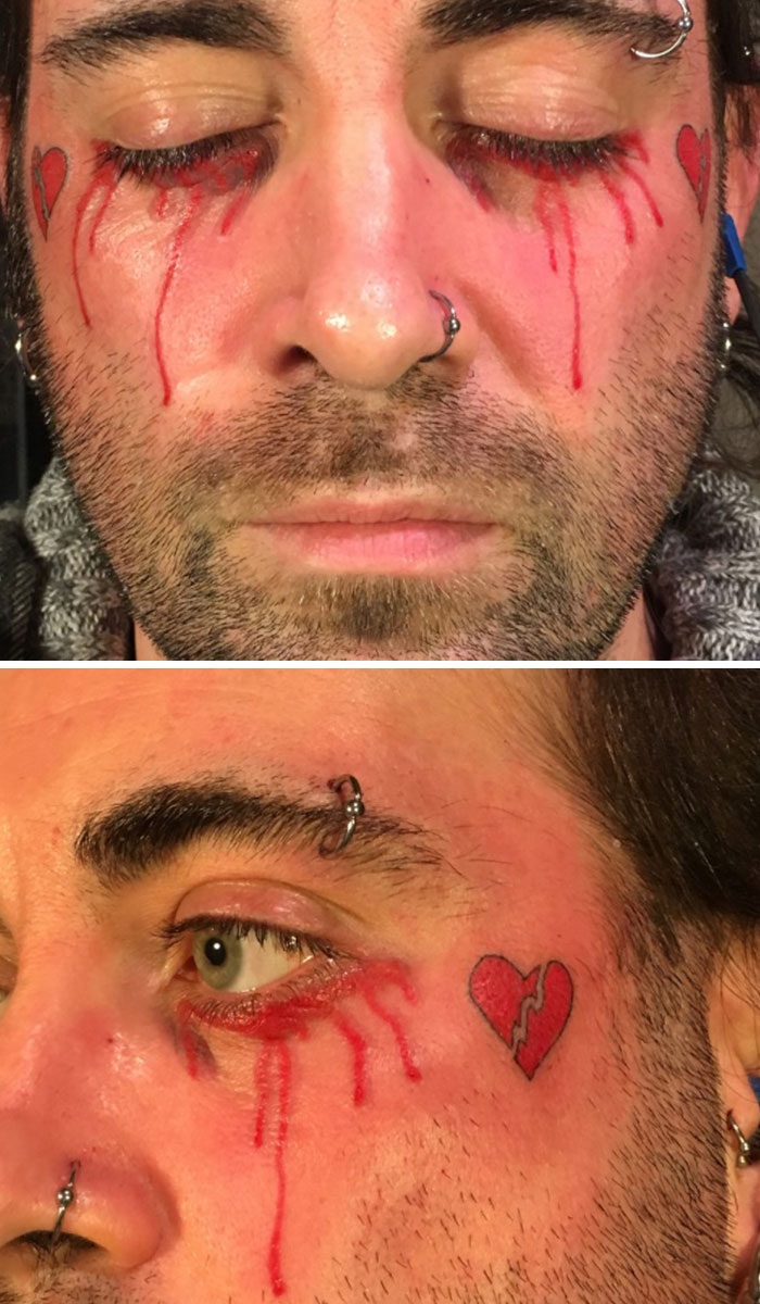 Close-up of a man's face showing tattoo fails with bleeding eye tattoos and broken heart designs on his cheeks.