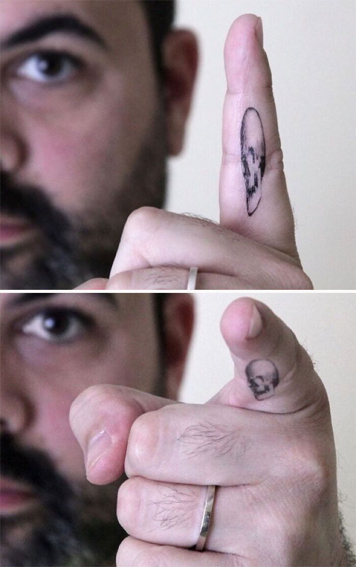 Optical illusion tattoo of a skull on a finger, creating a mind-bending effect.
