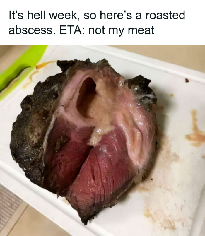Unappetizing food picture showing a piece of meat resembling a medical abscess on a cutting board.