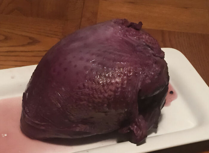 Unappetizing purple food blob on a white platter.