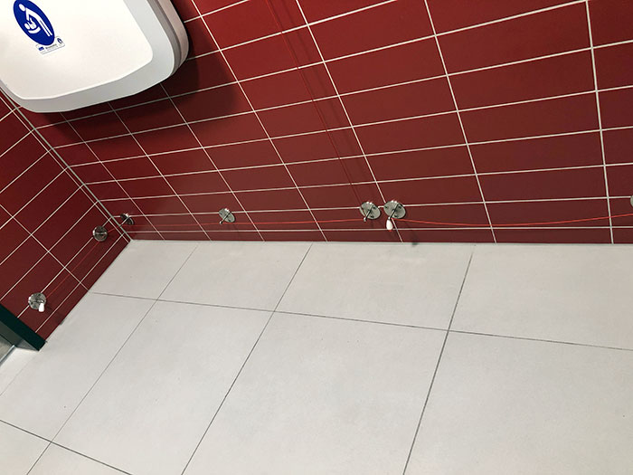 Emergency Alarm Chords Running Along The Floor Of The Disabled Toilet In Berlin Airport In Case Someone Falls Over And Requires Assistance