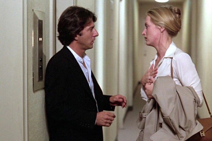 Ted and Joanna talking in the hallway 