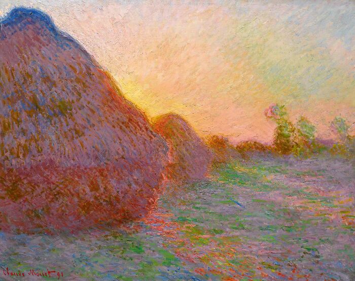 Meules by Claude Monet, 1890, oil painting features a bright and warm field with a diagonal row of grain stacks