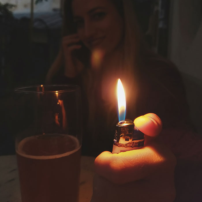 Woman holding a cigarette lighter
