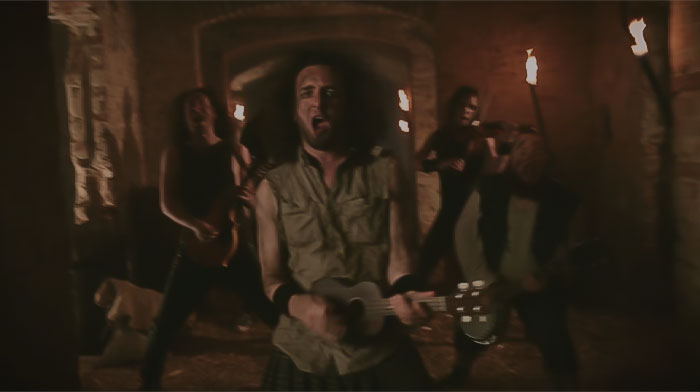 Scene from ALESTORM - Drink (Official Video) - three persons performing in cave