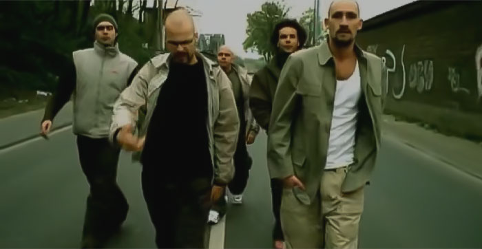 Scene from CURSE - Widerstand ft. Gentleman music video, five men walking in the street