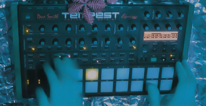 Image from KODEK /// DSI TEMPEST SKWEEE DRIVE music video - hands playing Tempest electronic music instrument