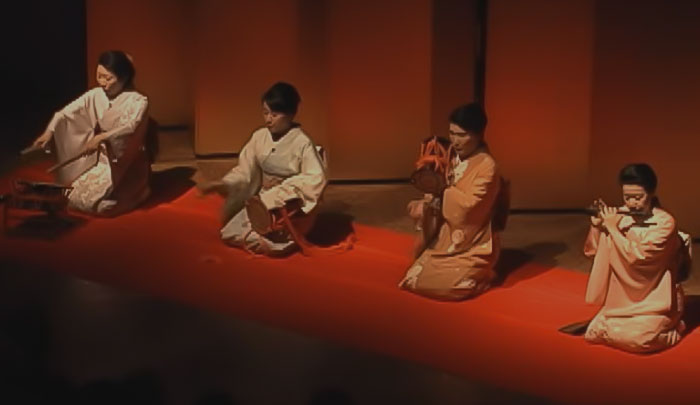 Four japanese persons in kimono performing Noh Theater on stage